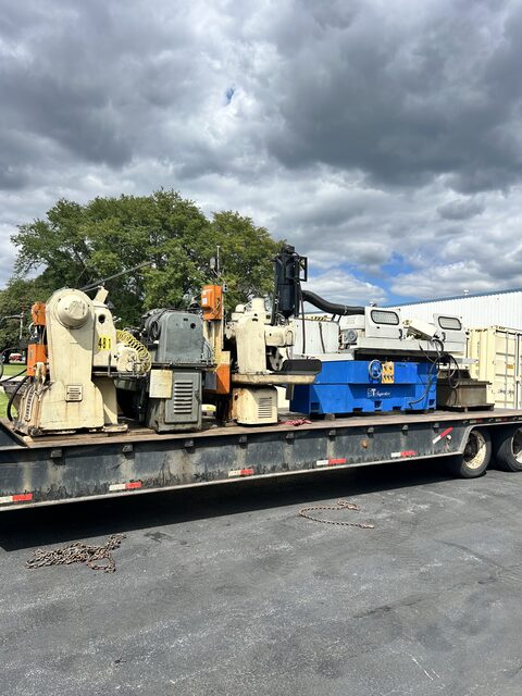 A flatbed load of punch presses and a Tsugami machining centre, chained down and ready to roll