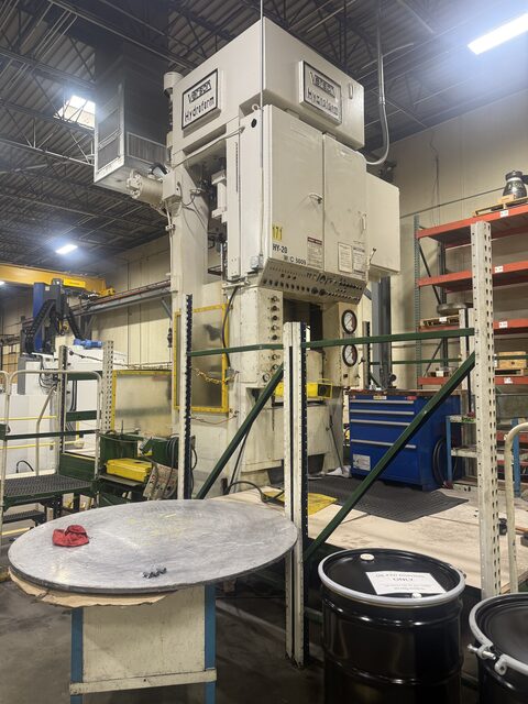 A Verson Hydroform press standing on the plant floor, before we took it apart