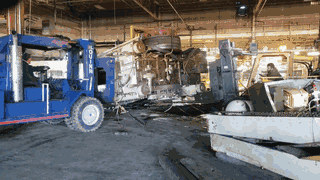 Video: walking the floor around a press laid over on its side, our forklift and truck working it