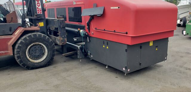 Our big Taylor forklift loading an EFI VUTEk wide-format printer