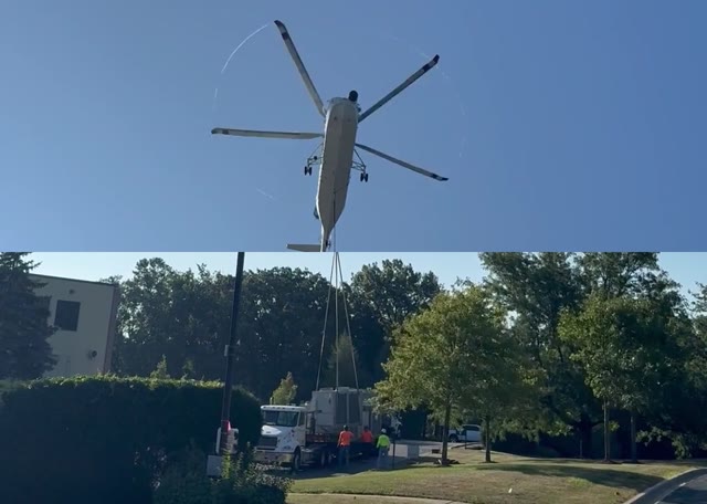 A heavy lift helicopter lowering a rooftop condensing unit onto our truck (10 second video, no sound)