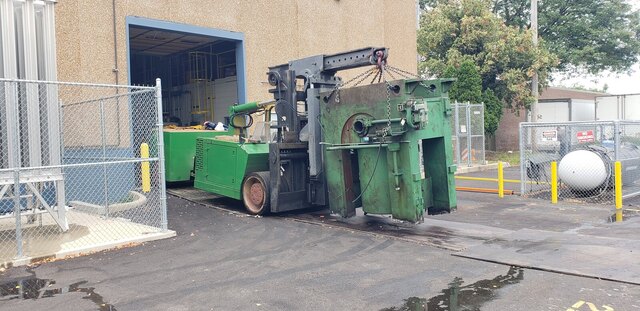 Carrying a scrap machine out on chains, slung under the Versa-Lift