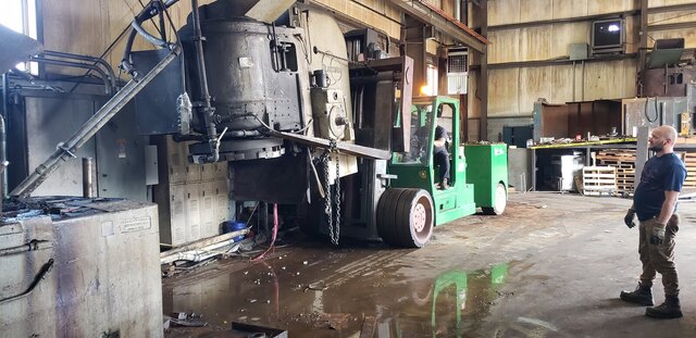 Our Versa-Lift pulling a grinder out of a plant, chained and ready to travel