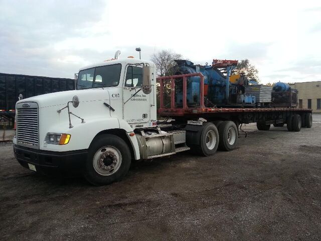 Scrap machinery sections leaving on our flatbed semi