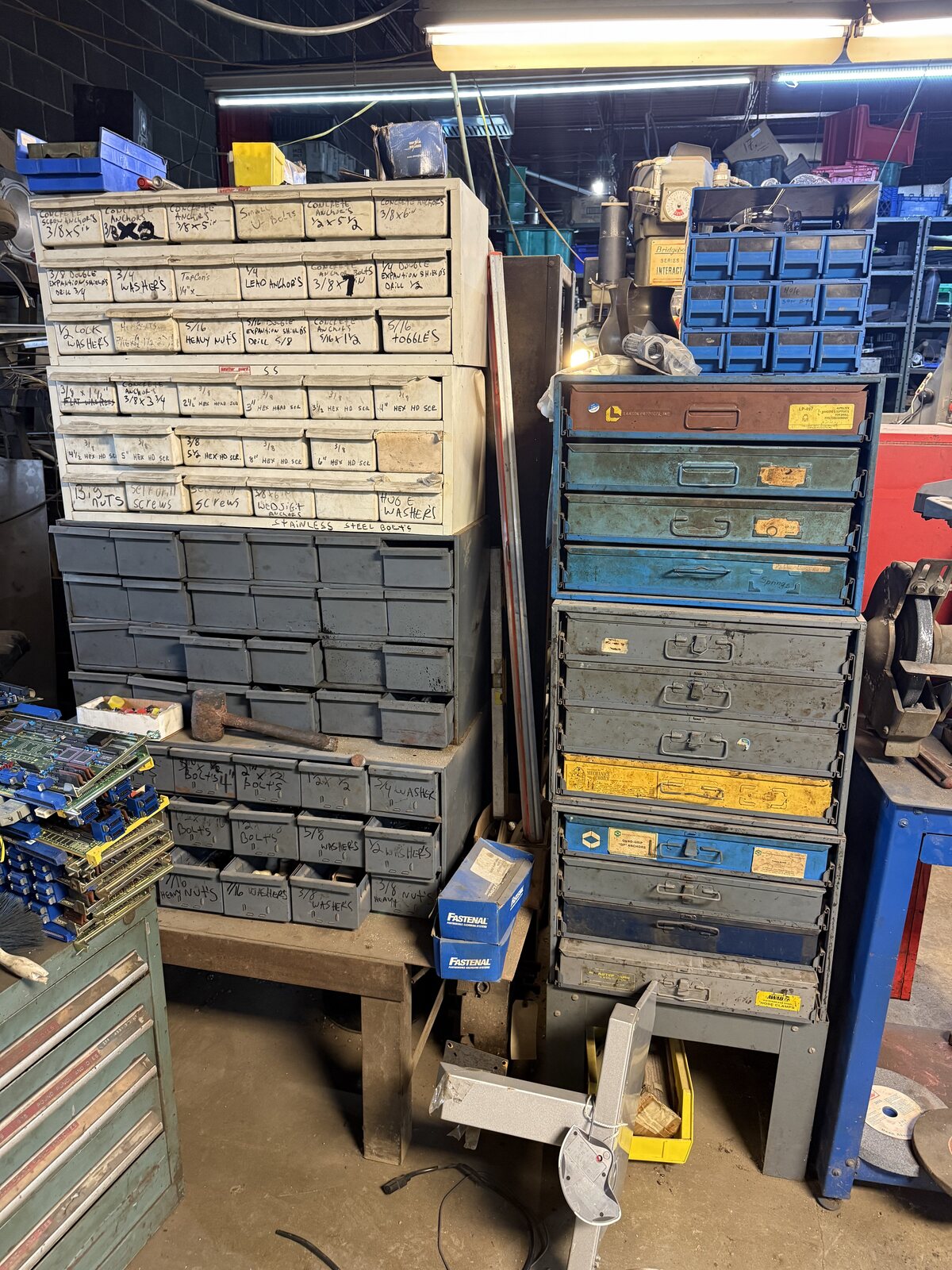 Labeled drawers of bolts, nuts and washers sorted by size