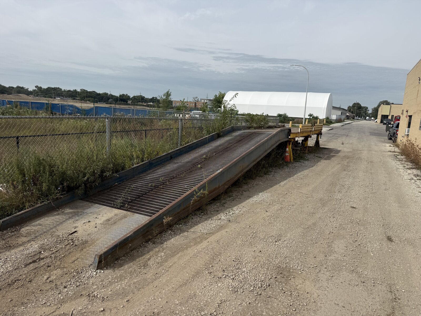 Our portable steel loading ramp with the forklift deck we built at the top of it, in our yard in Berkeley