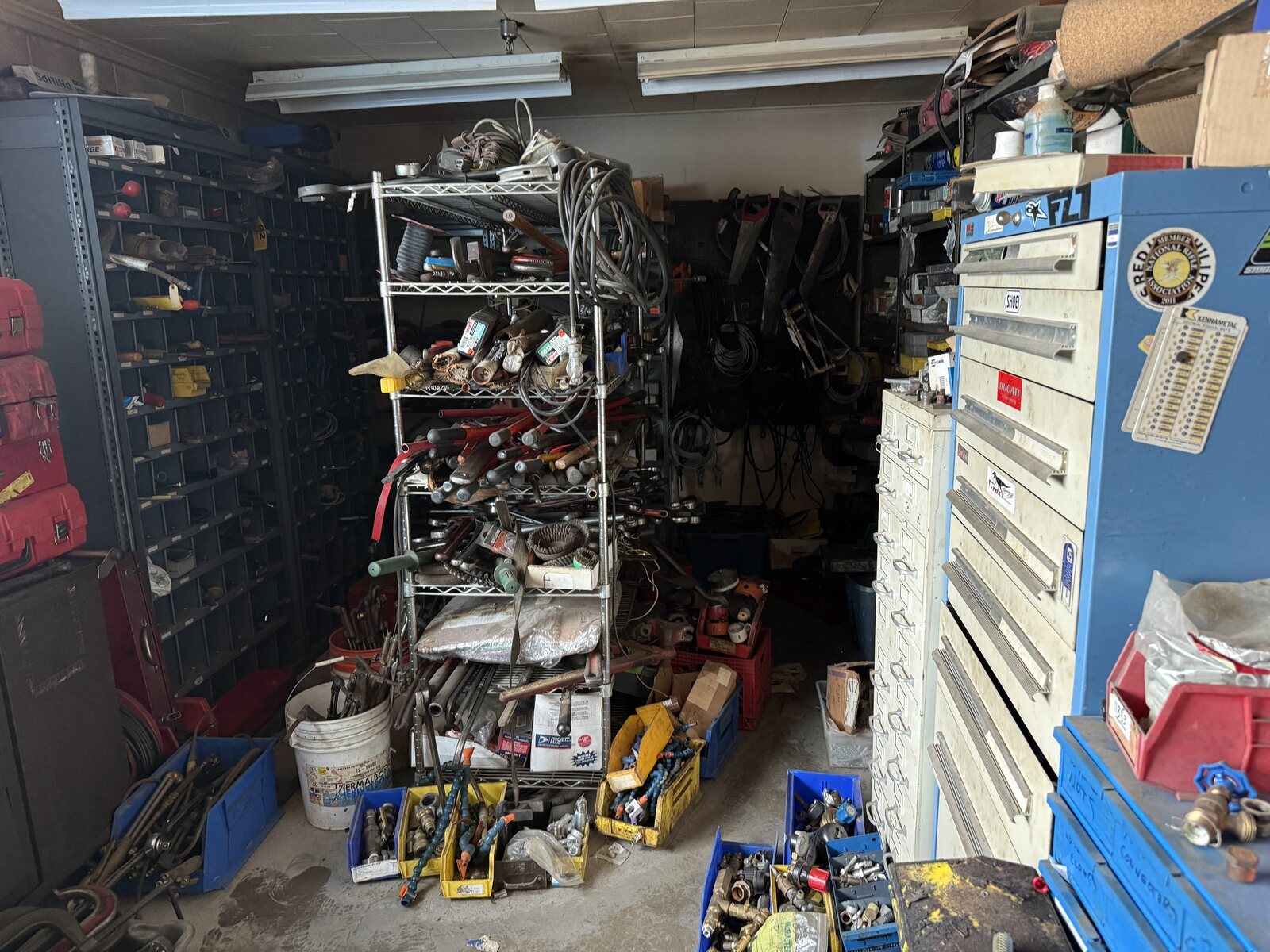 The tool room, racks of grinders and drills and a tool chest