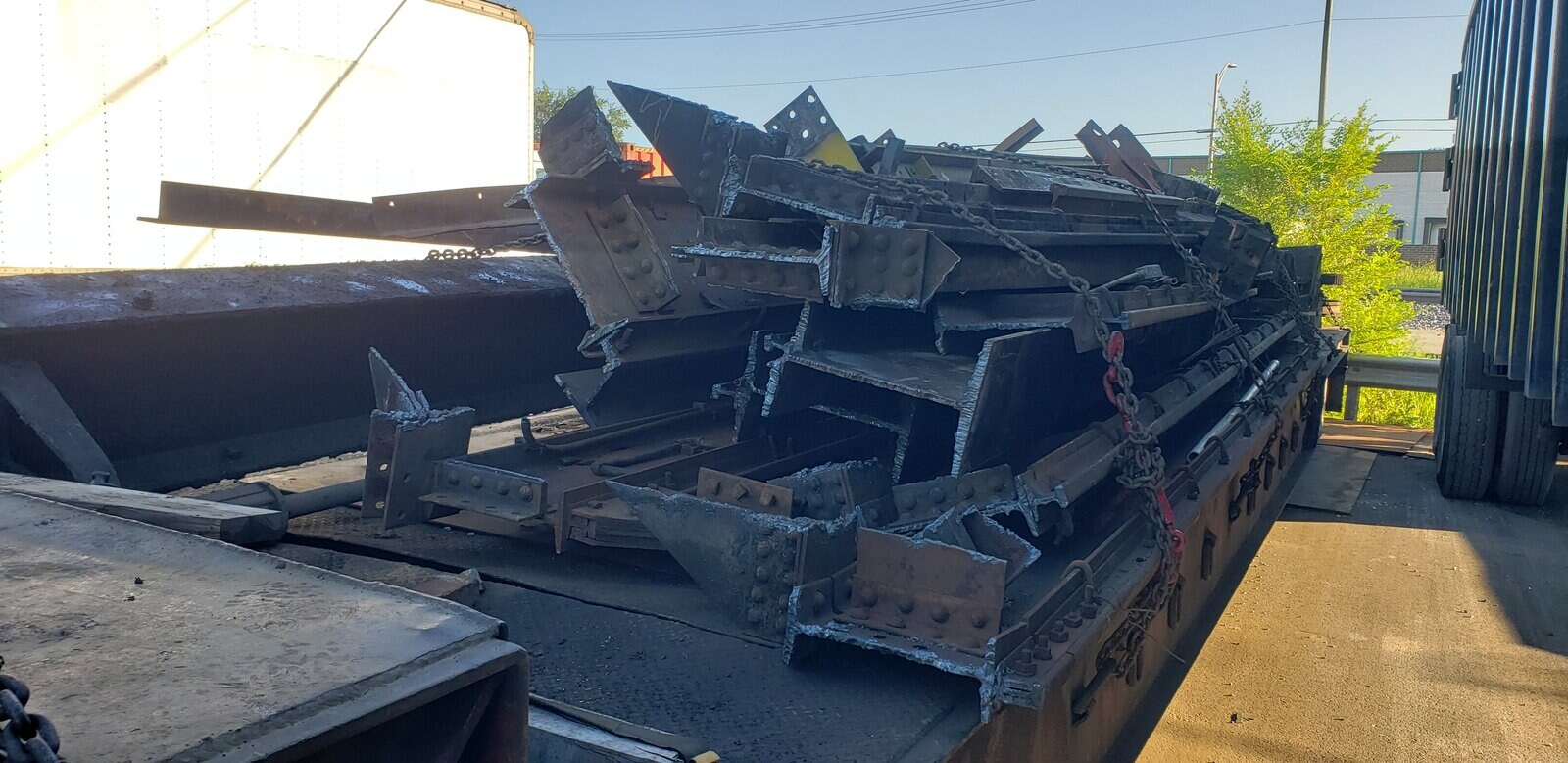 A trailer loaded with torch-cut structural steel