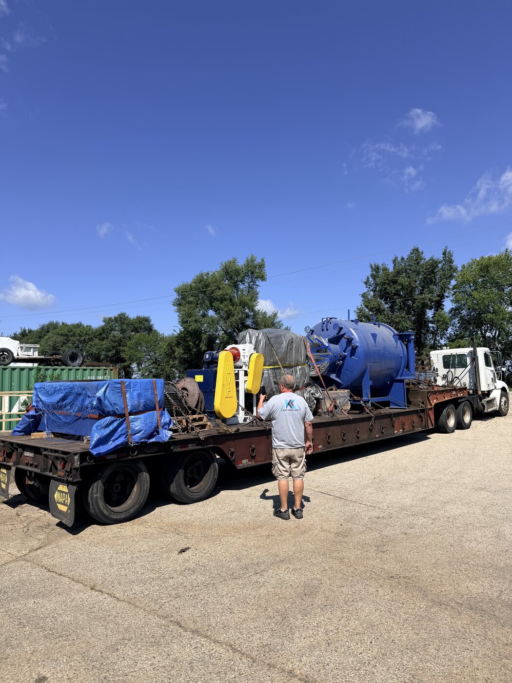 The same load on the trailer at the Wisconsin end, Igor walking it before unloading, a yellow lifting attachment on the deck