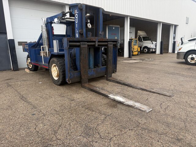 The blue forklift seen from the front