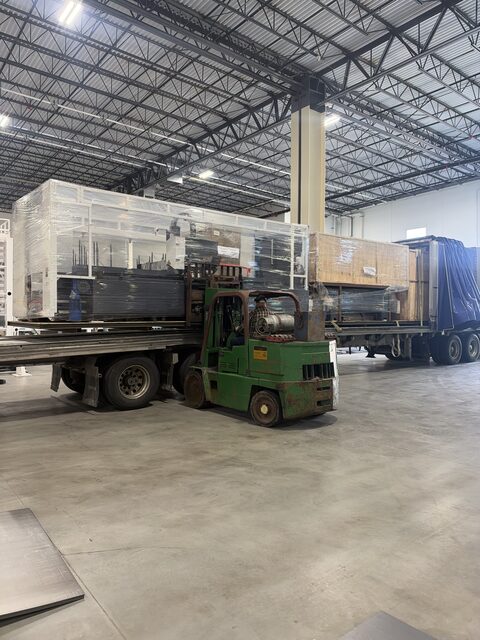 Our forklift beside the loaded trailer