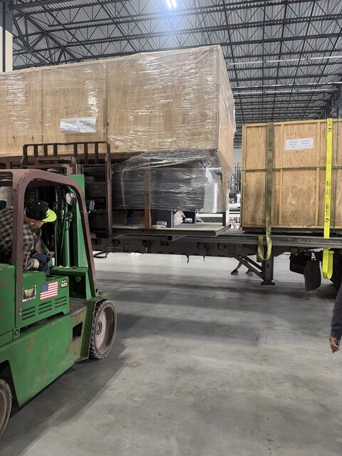 Our forklift setting the crate on the trailer deck