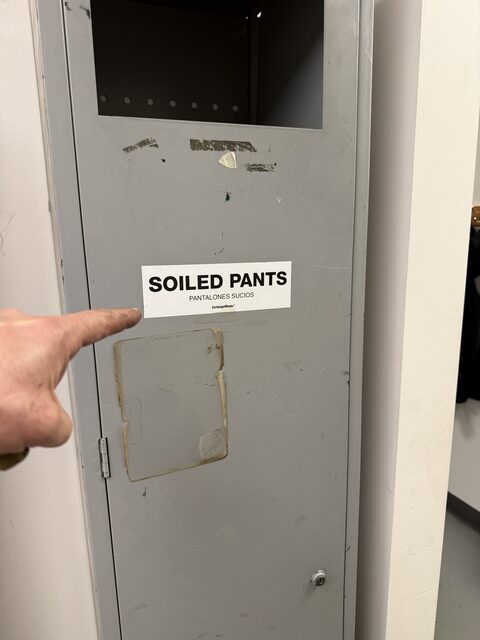 A locker labeled "SOILED PANTS"