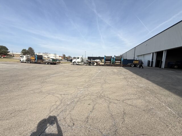 Press units on two trailers in the yard