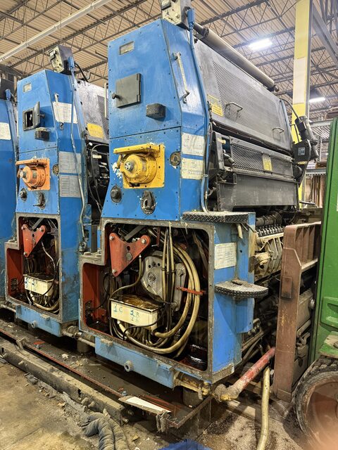 Two press units with the side covers off