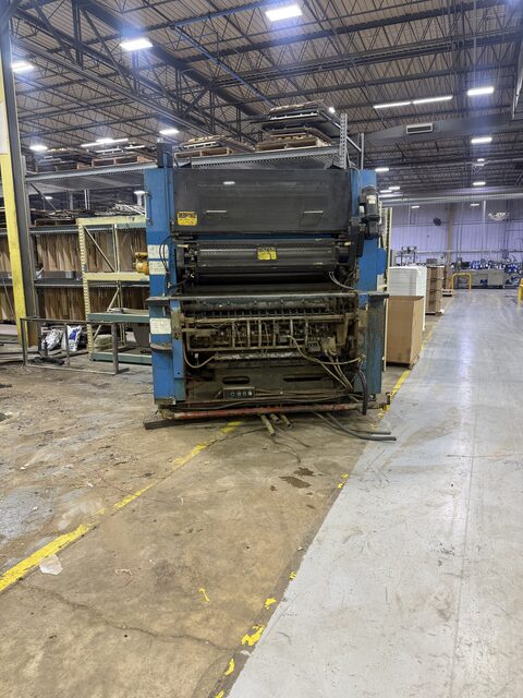 The separated press unit standing by the aisle